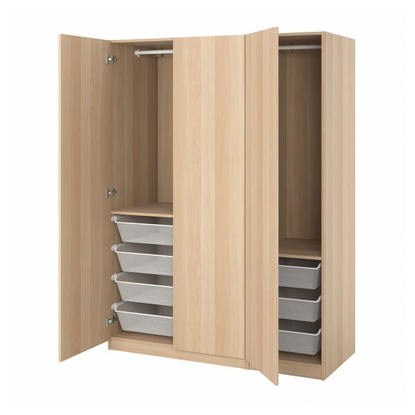 Wooden PAX wardrobe open, light-colored with fabric drawers.