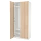 An open ikea PAX wardrobe in white with light wood doors. It has shelves and a clothes rail inside.