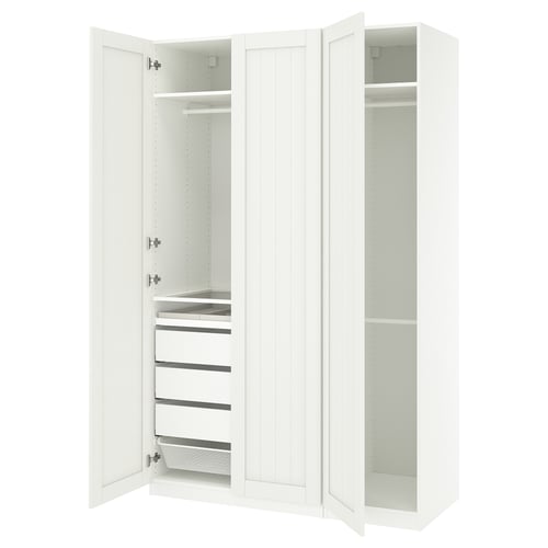 A white ikea PAX wardrobe with open doors revealing shelves and drawers.