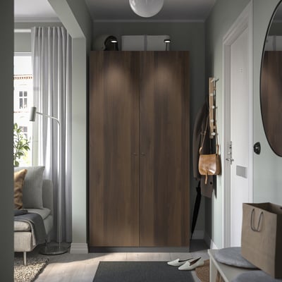 Modern entryway with dark brown PAX wardrobe, stylish storage solution.