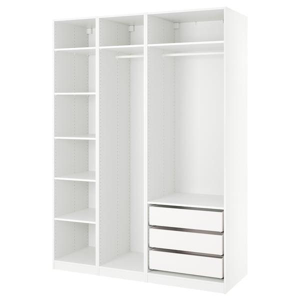 An ikea PAX wardrobe in white with a modular design featuring shelves and drawers.