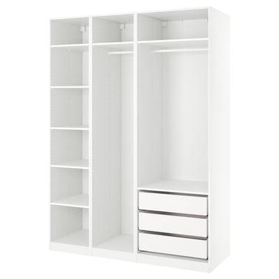 An ikea PAX wardrobe in white with a modular design featuring shelves and drawers.