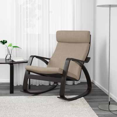 Beige POÄNG rocking chair with dark frame, high back and seat cushion, in modern living space.