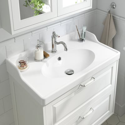 White RUTSJÖN ceramic wash-basin, rectangular, with draining system.
