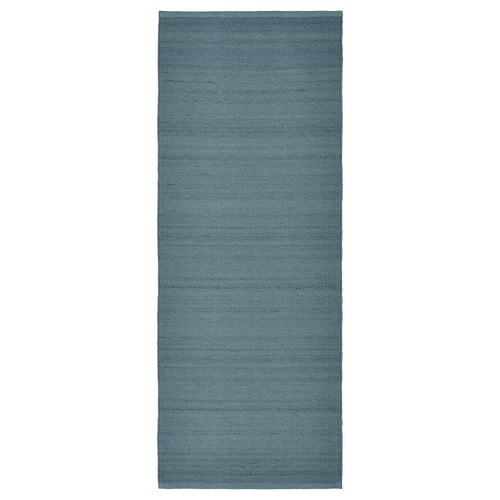 A grey-blue rectangular TIDTABELL rug with a textured, woven design. Its made with cotton and wool, ideal for cosy floors.