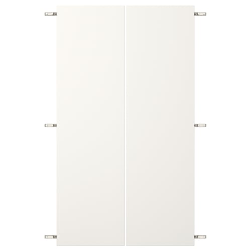 White VEDDINGE cabinet doors with nickel hinges