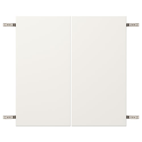 White VEDDINGE cabinet hinge detail, nickel-plated steel and fibreboard.