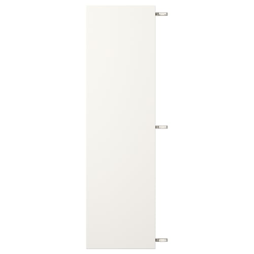 White VEDDINGE cabinet with nickel hinges.