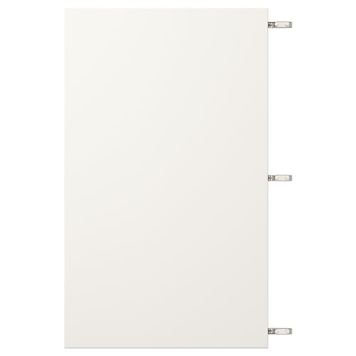 White VEDDINGE cabinet door with nickel hinges.