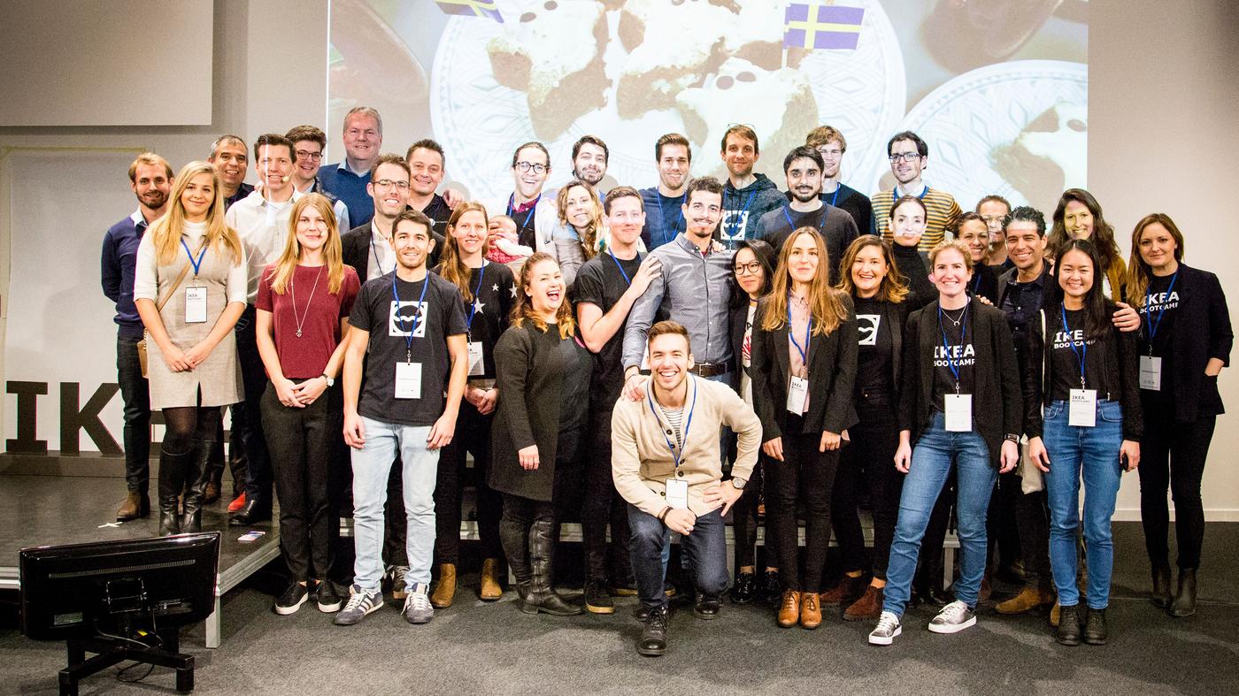 A large group of people standing together in a room posing for a photograph.