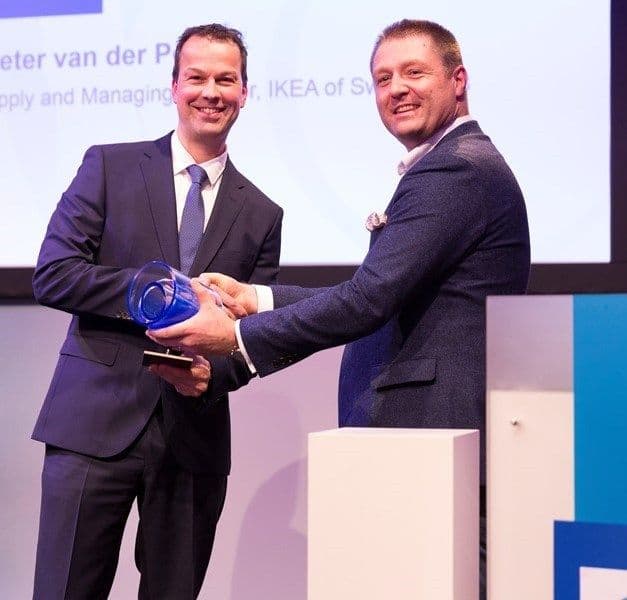 Peter van der Poel looks at the camera while accepting an award.