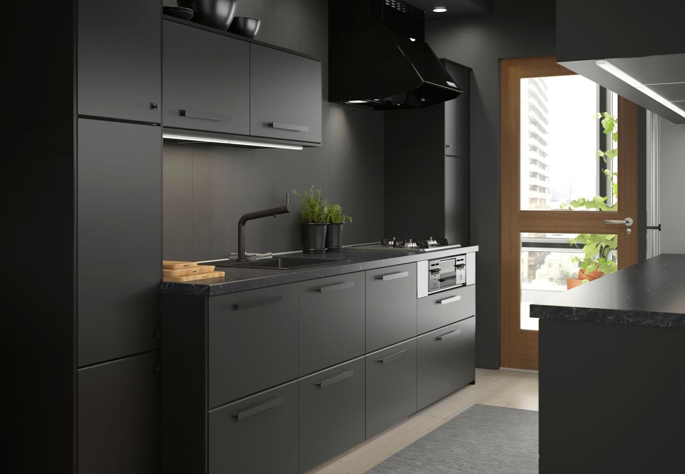 A black kitchen featuring KUNGSBACKA kitchen fronts.