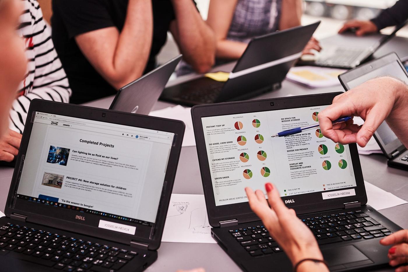 Several open laptops on a table