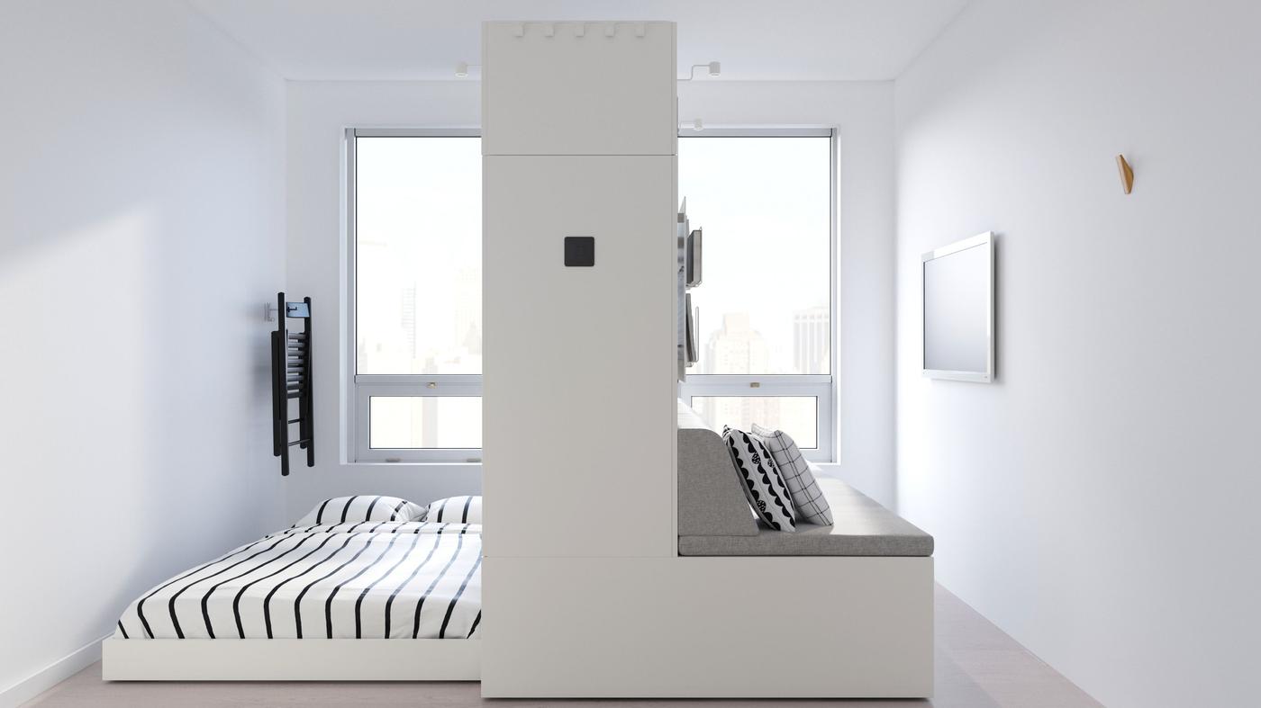 A robotic bed and sofa that move, in a small living space.