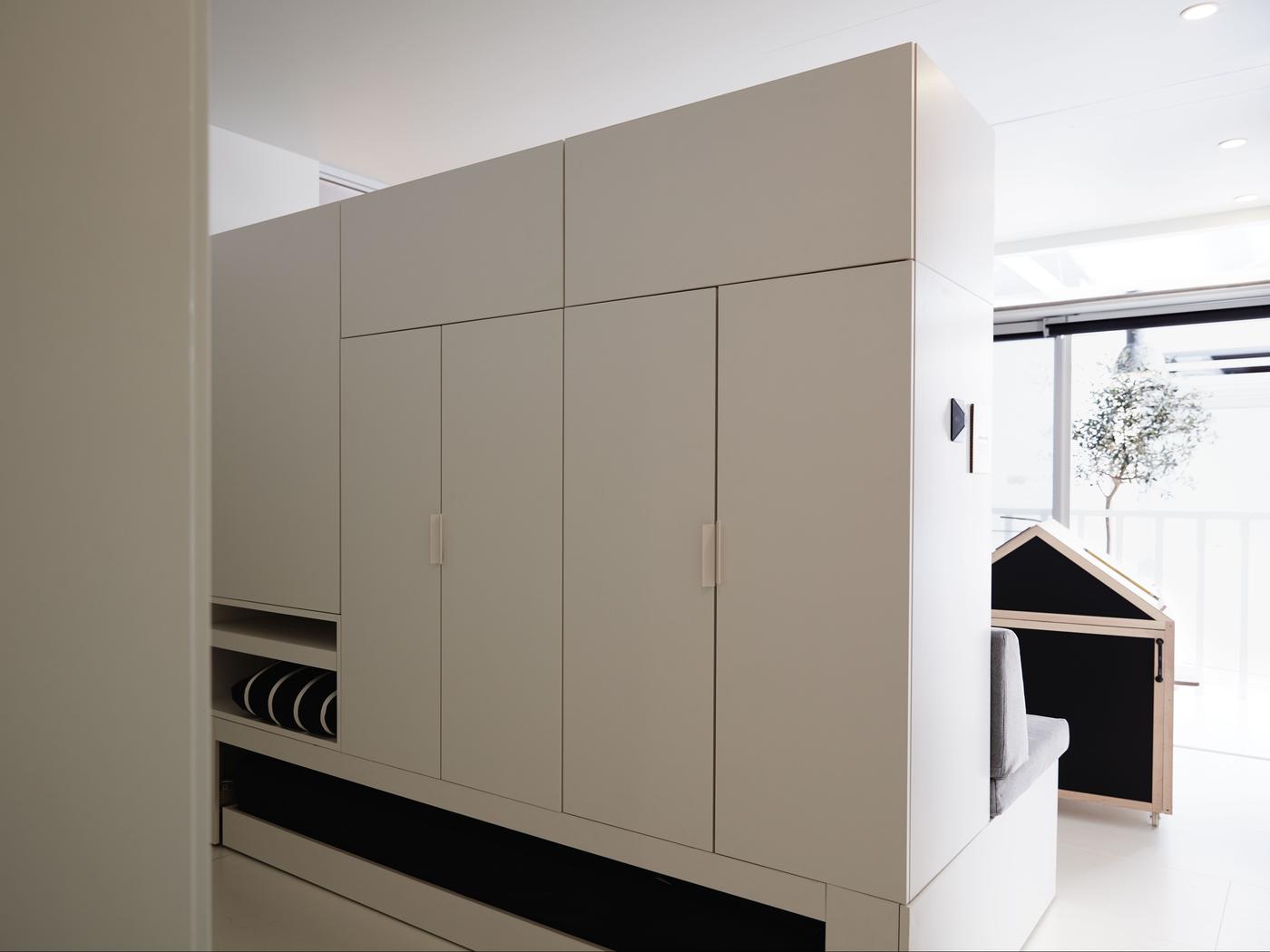 A robotic storage unit  that moves, in a small living space.