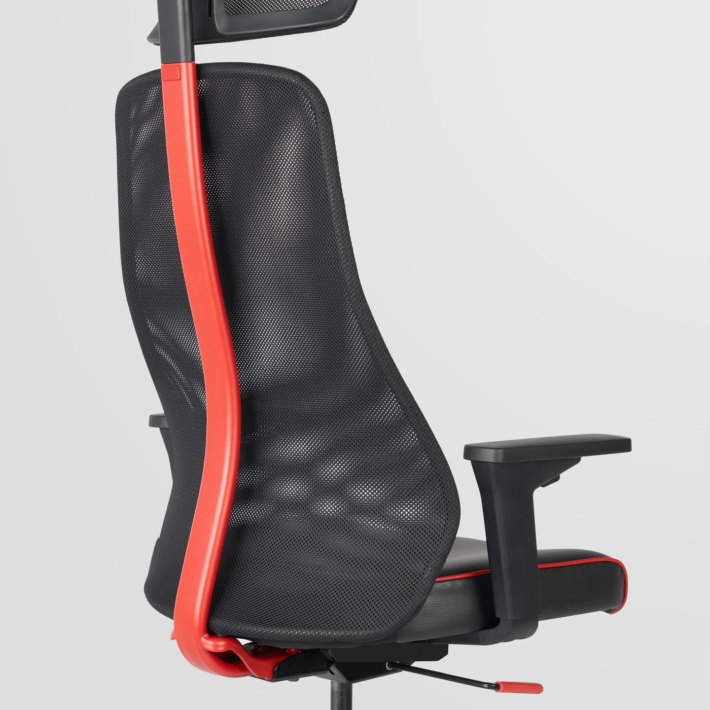 The back a black gaming chair with a red pole leading to the headrest. The background is grey.