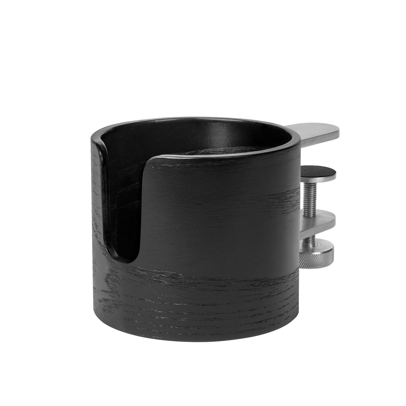 A black mug holder against a white background.