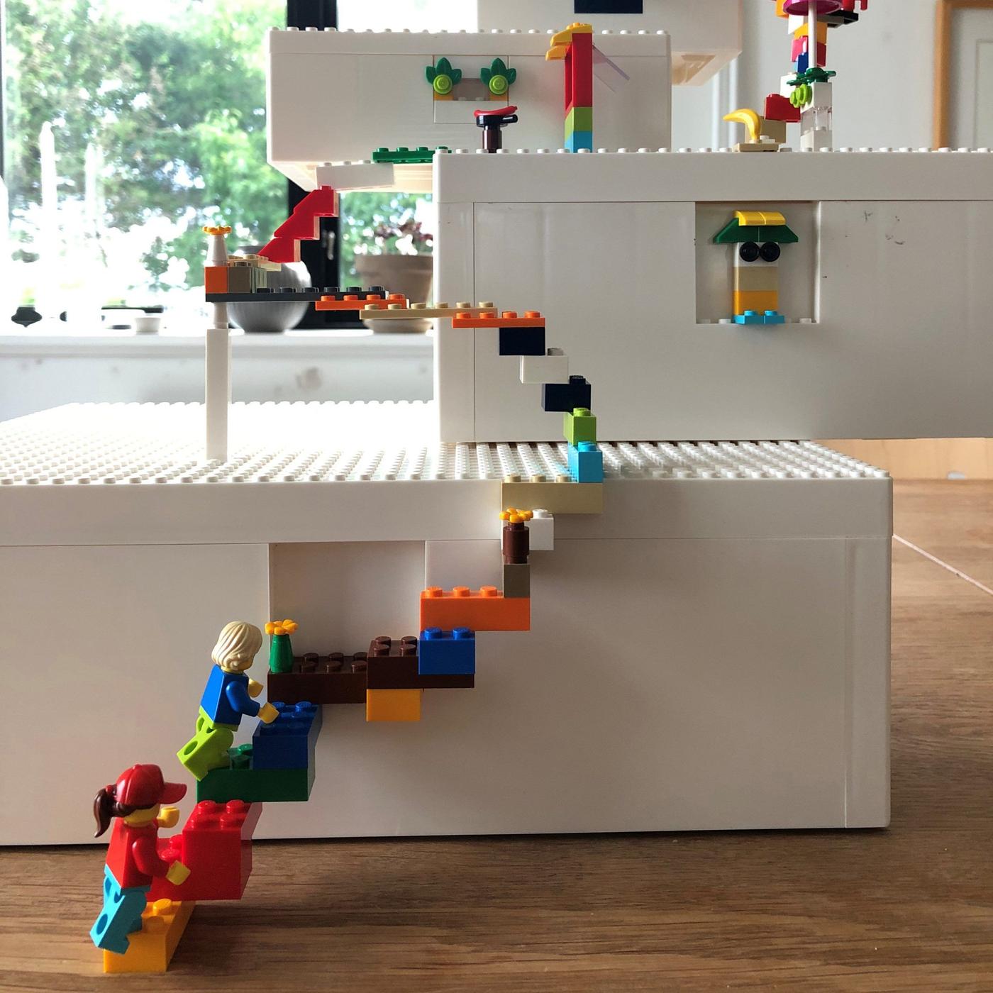 A multicoloured scene in steps built with BYGGLEK LEGO boxes in different sizes.