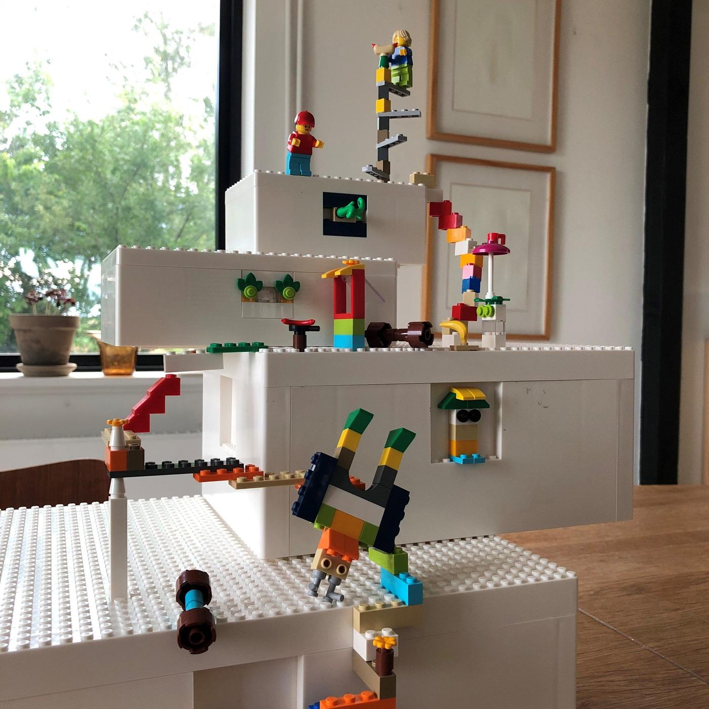 A multicoloured scene in steps built with BYGGLEK LEGO boxes in different sizes and brick set.