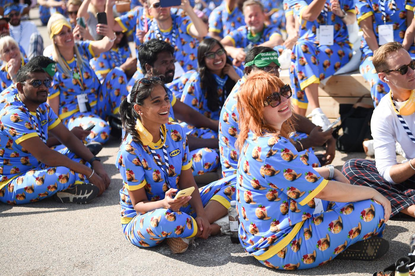 People with identical pyjama are sitting next to each other