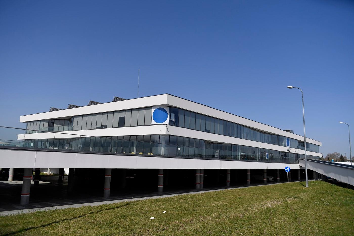 A facade of a building with two blue dots.