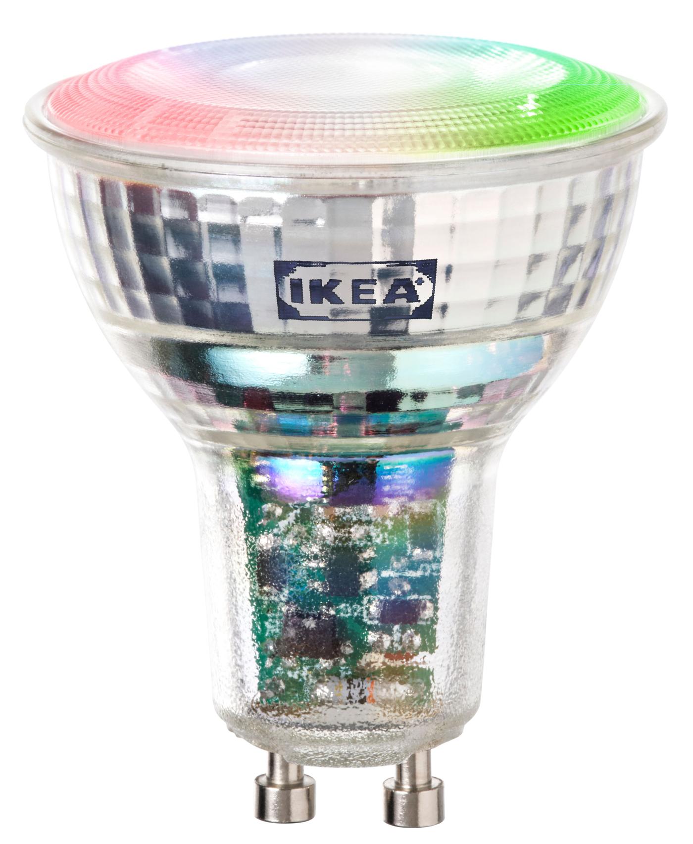 Silver directional spotlight bulb with flat surface, featuring rainbow-like colors including green and red, shown against a transparent background.