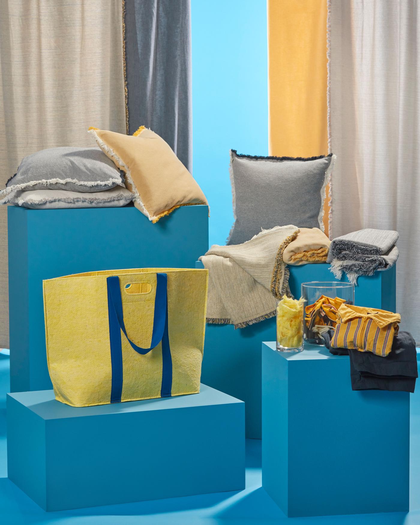 The VÄXELBRUK collection consisting of textile products such as curtains, cushion covers, throws and bags. 