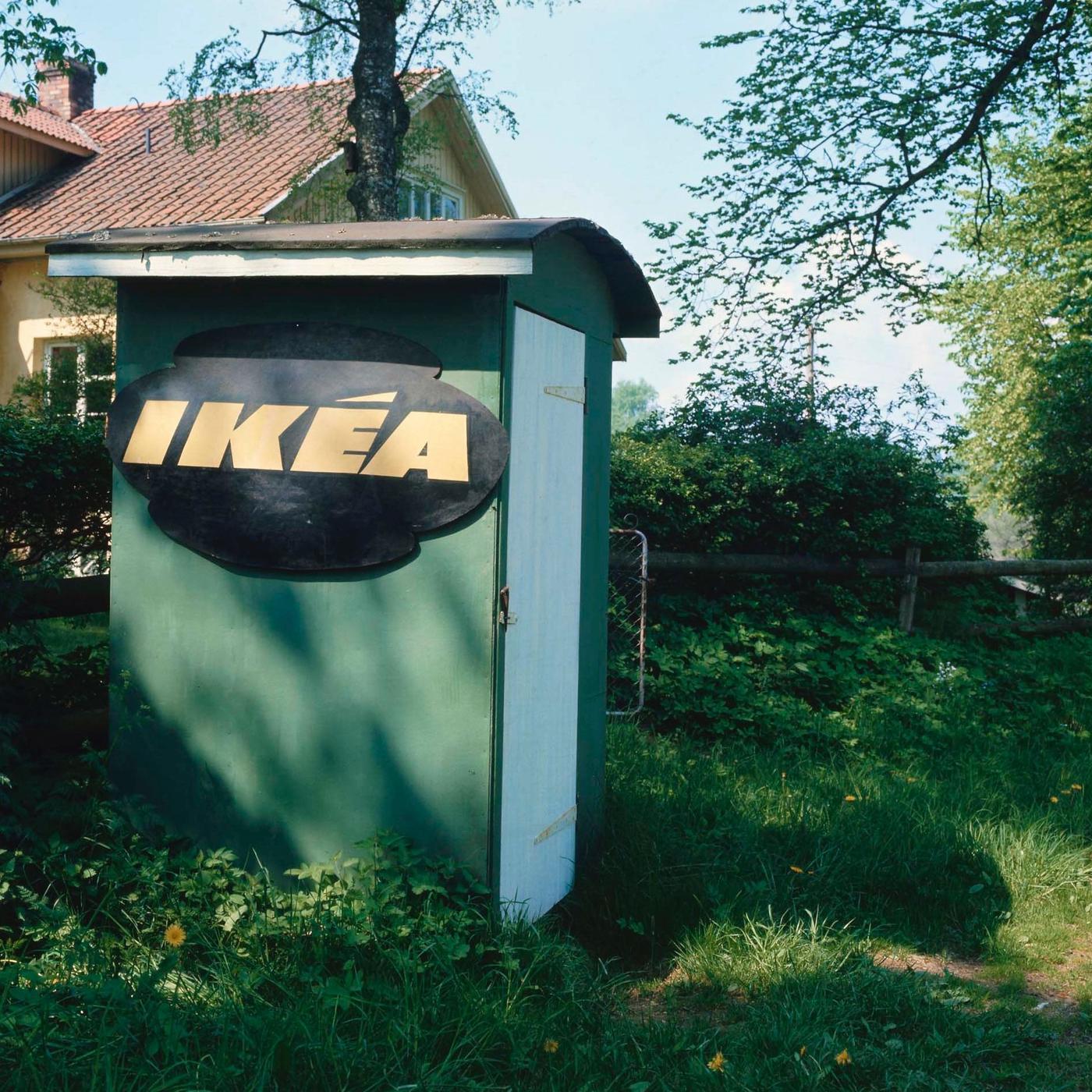 An old photograph of a small, green shed with the IKEA logo on the side.