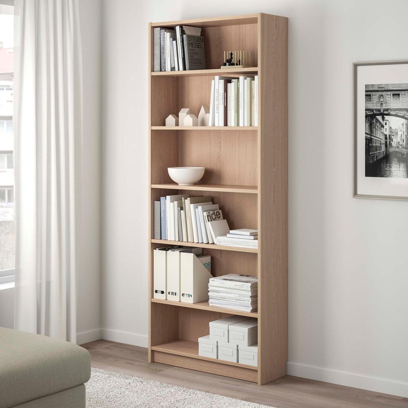 A BILLY bookcase with books and objects on it.