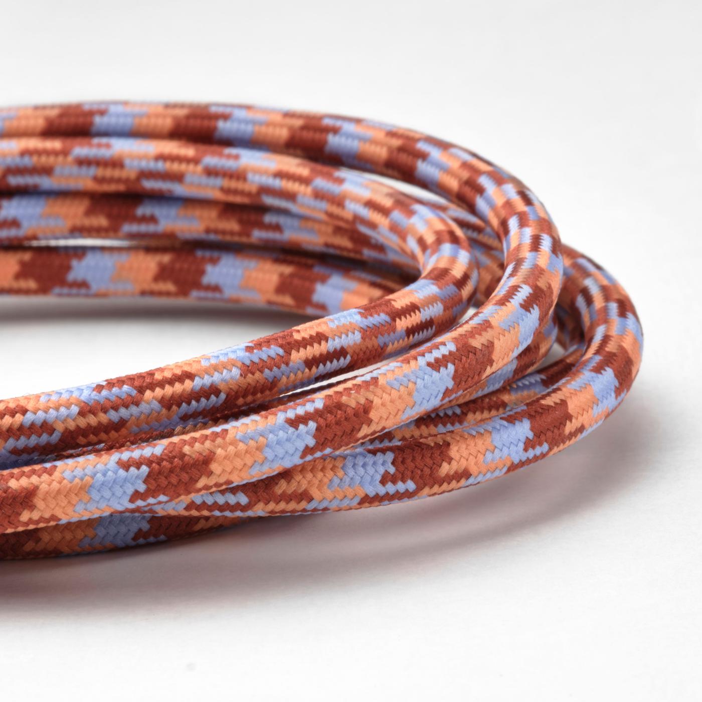 Close-up of textured and patterned charging cable with vibrant colors including red, brown, and blue.