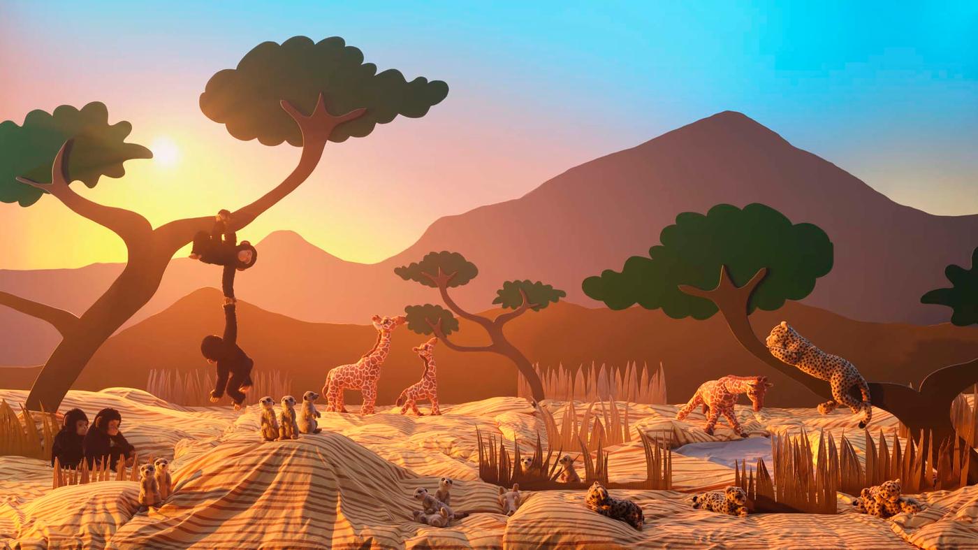 A scene showing soft toy wild animals in an imaginary African savannah setting.