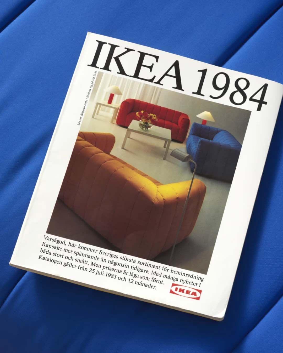 An image showing the front cover of the 1984 IKEA catalogue on a blue KLIPPAN sofa.