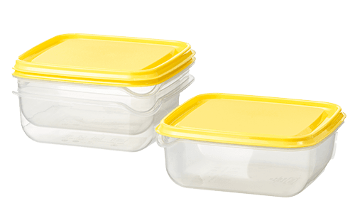 A stack of transparent food containers with yellow lids.