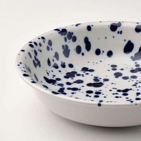 Close up of a SILVERSIDA deep plate on a white background.