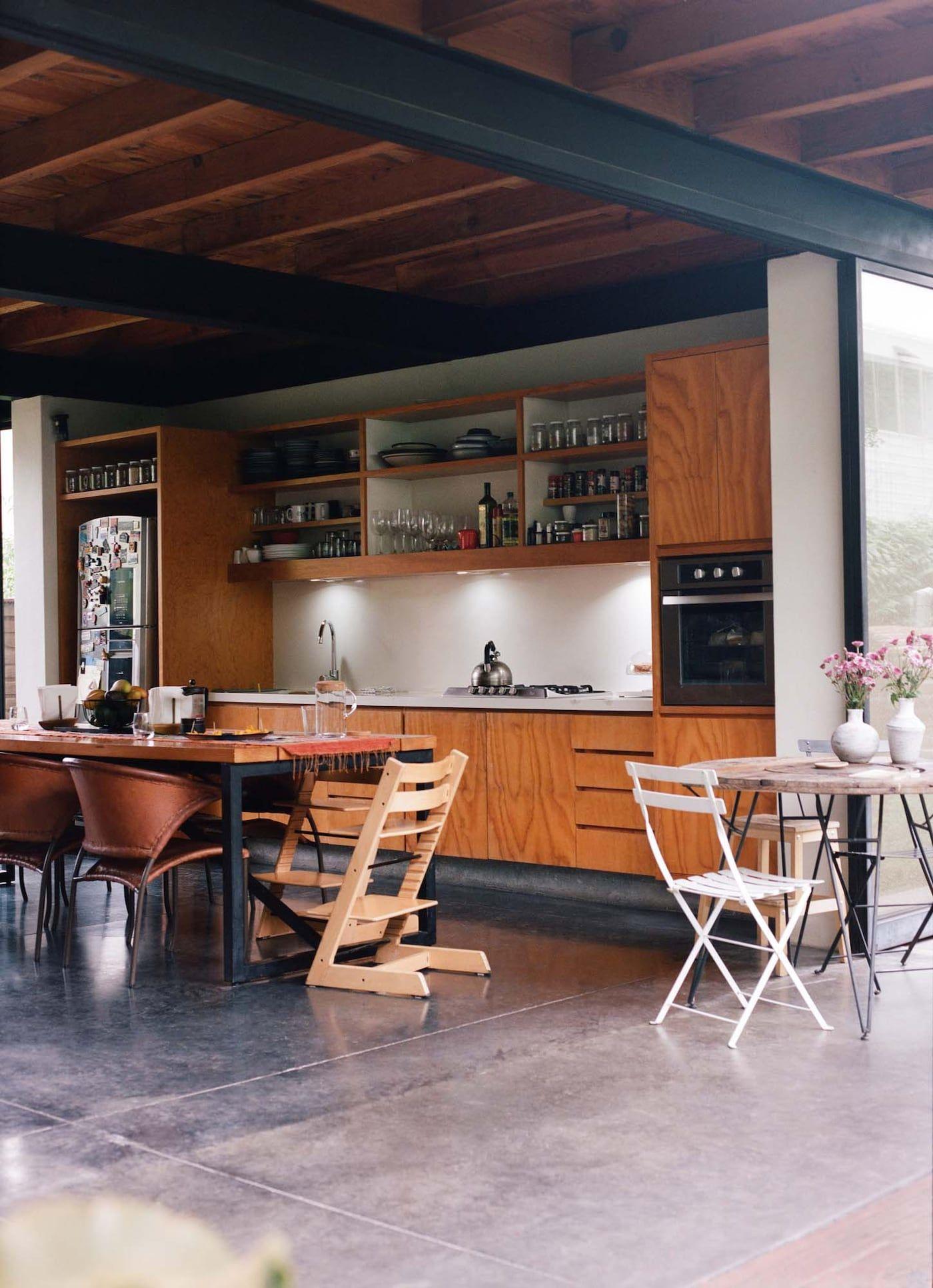 An open-plan kitchen, dining area and undercover outdoor space.