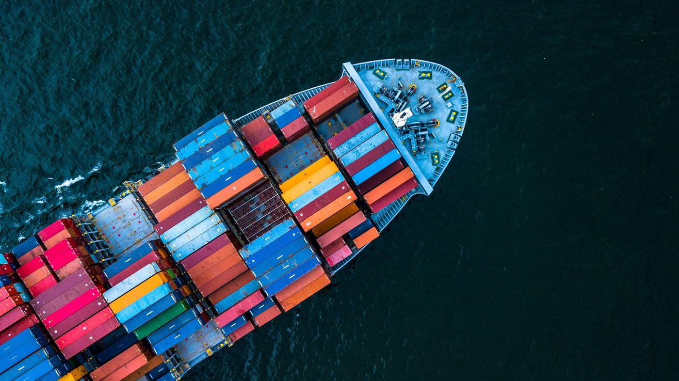 Aerial top view of a container cargo freight vessel.