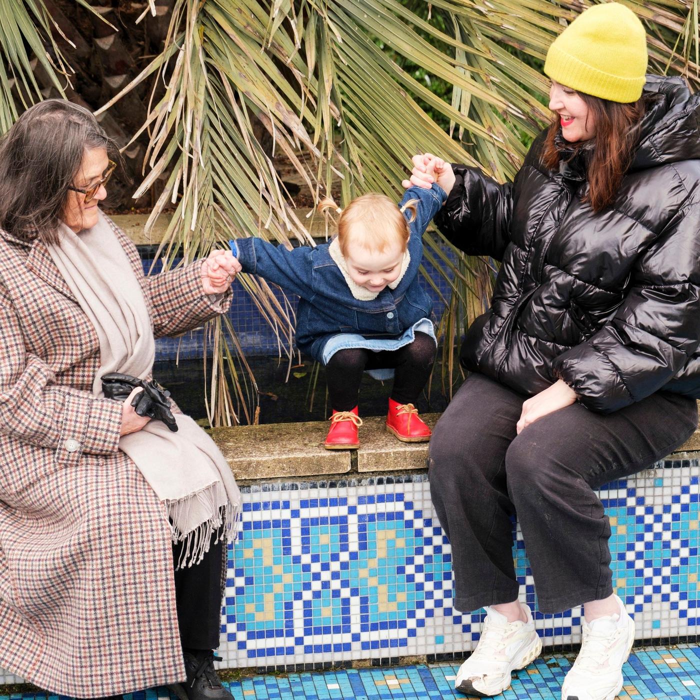 A grandmother, her daughter and a baby girl.