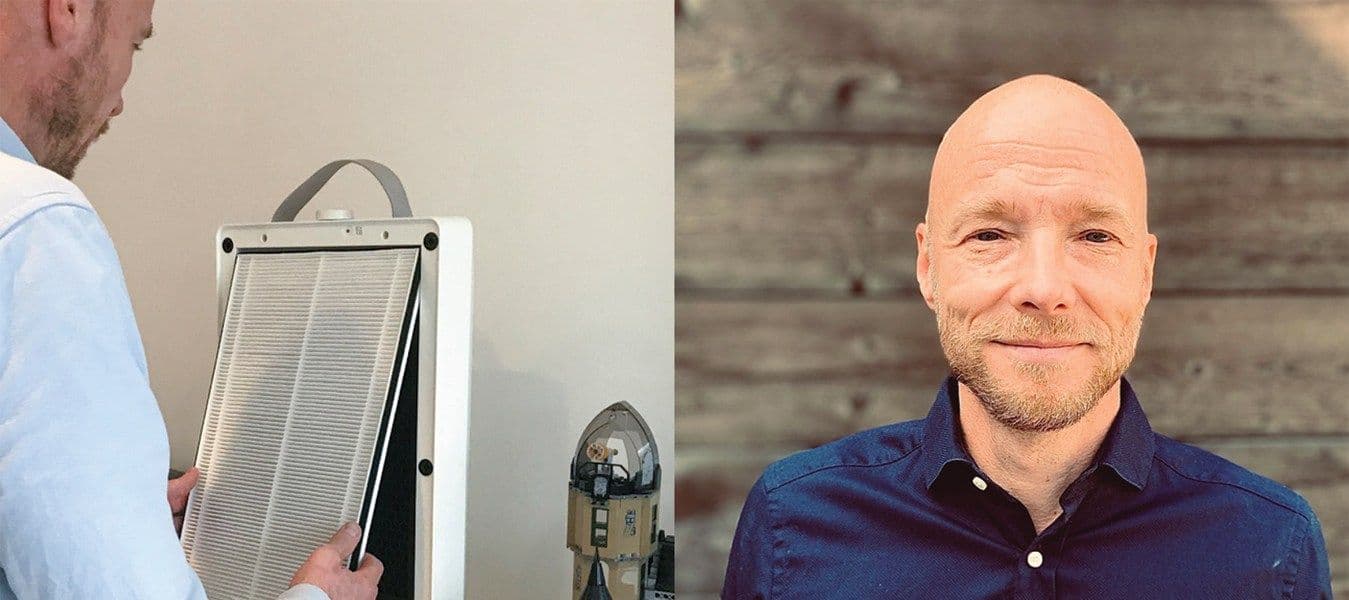 A man and an air purifier.