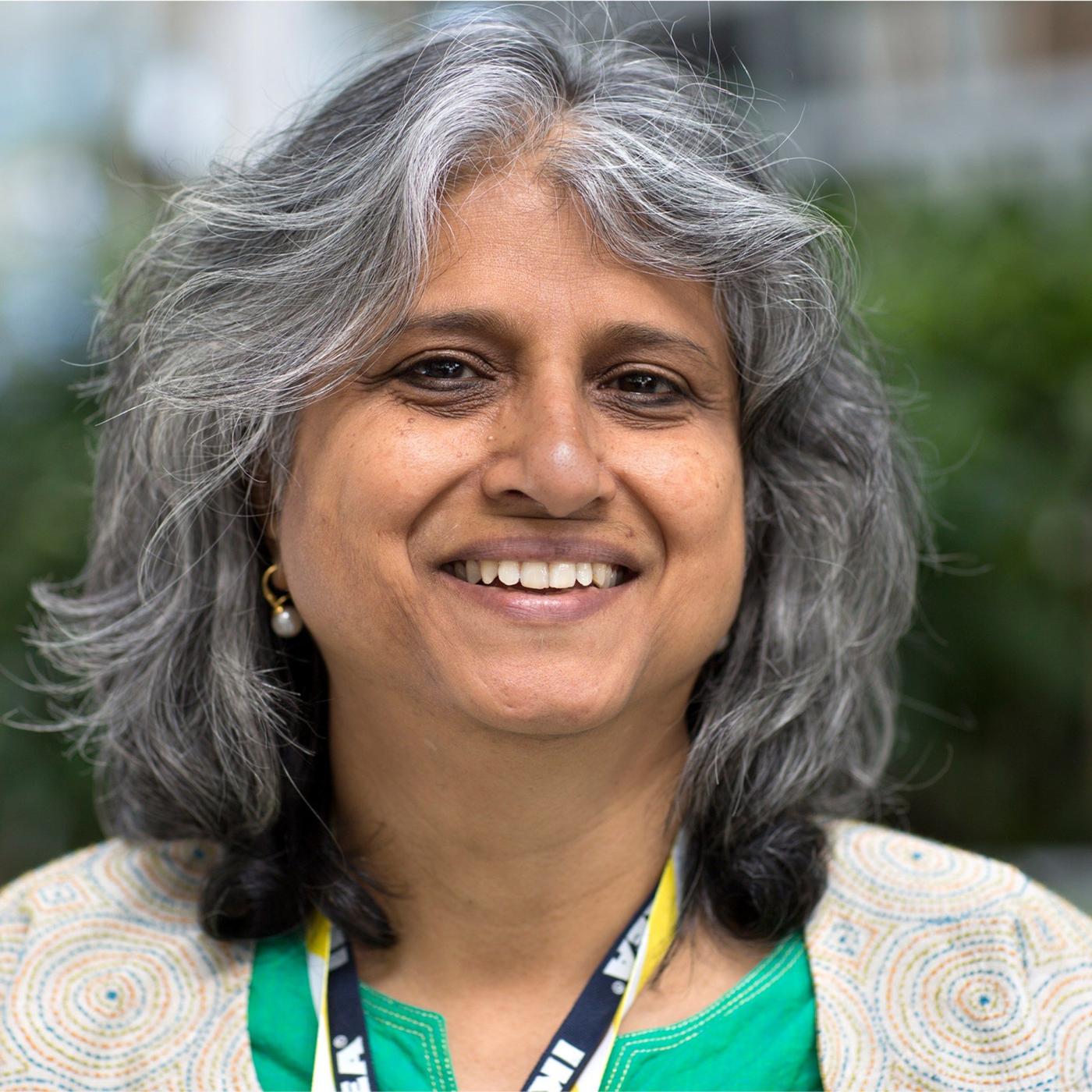 A smiling portrait of Neelam Chhiber, Managing Trustee at Industree Craft Foundation in India.