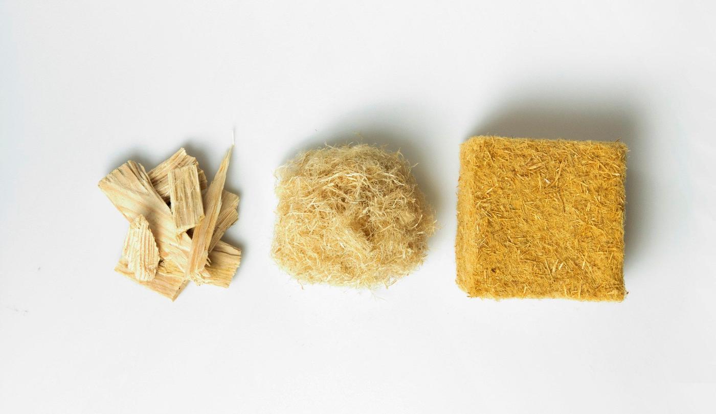 Three stages of components being used for wood wool – wood chips, wood shavings and the final wood wool.