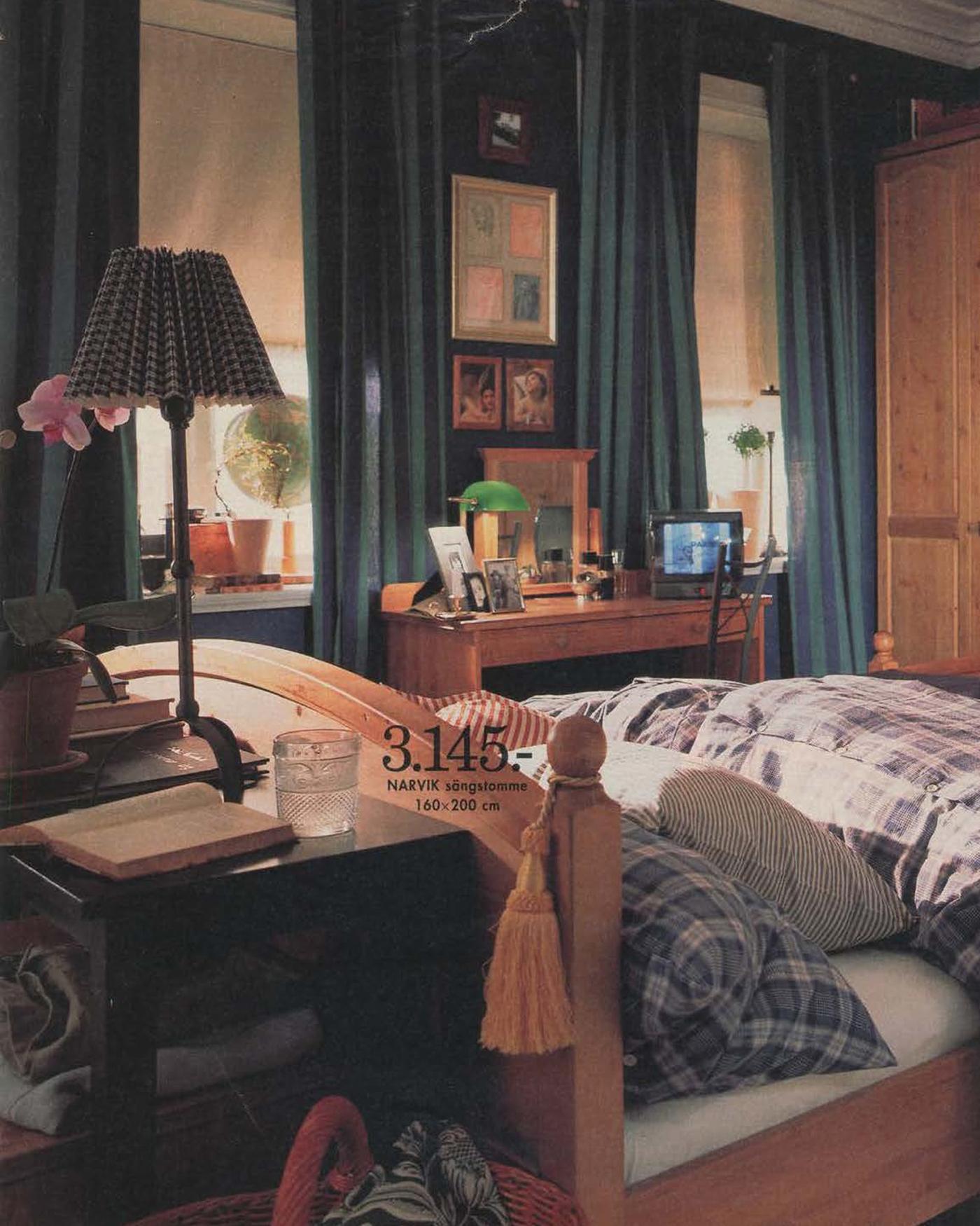 A blue bedroom from the 1996 catalogue, with a small portable TV on the dressing table.