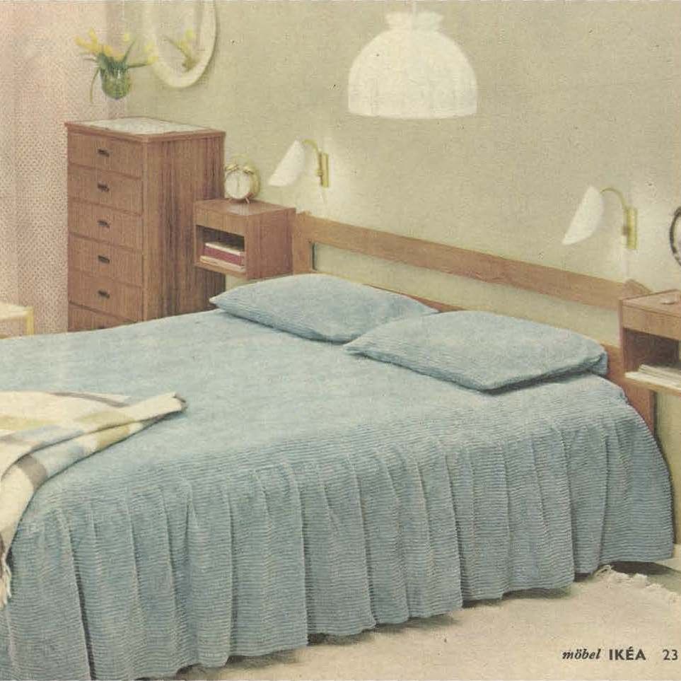 The 1962 IKEA catalogue showing a bed with a light blue flounce and light blue pillows.