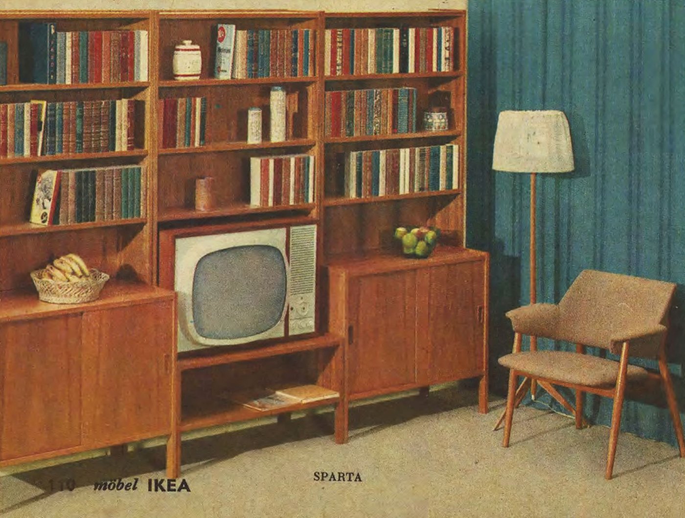 The 1965 IKEA Catalogue showing the SPARTA wood storage unit filled with books and a TV next to a chair and lamp.