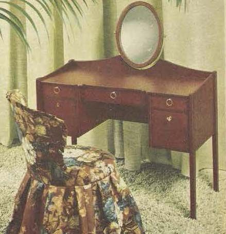 The 1966 iKEA catalogue, showing a dark wood dressing table with an oval mirror and a chair.