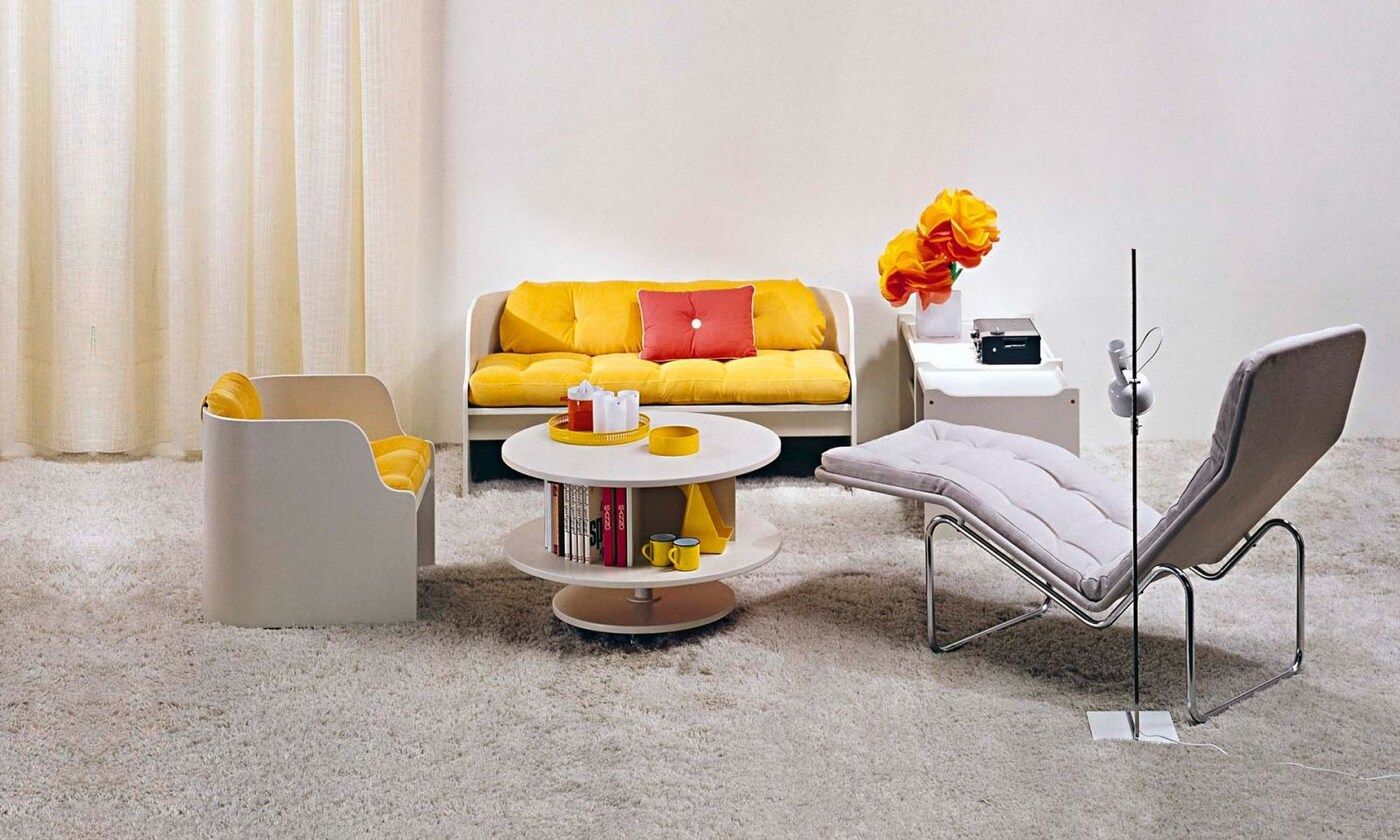 KARUSELL table and KATINKA chair and sofa on a cream carpet