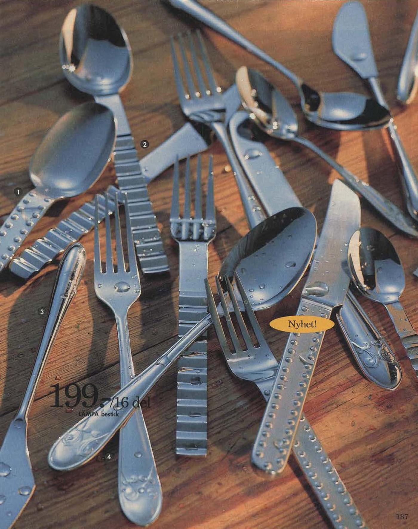 A selection of cutlery, some with curved handles from 1996.