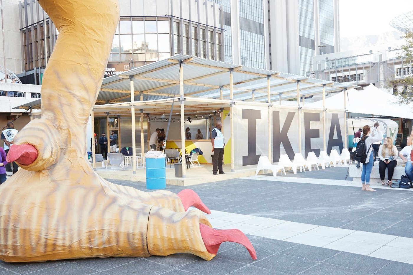 A giant chicken foot with an IKEA sign in the background.