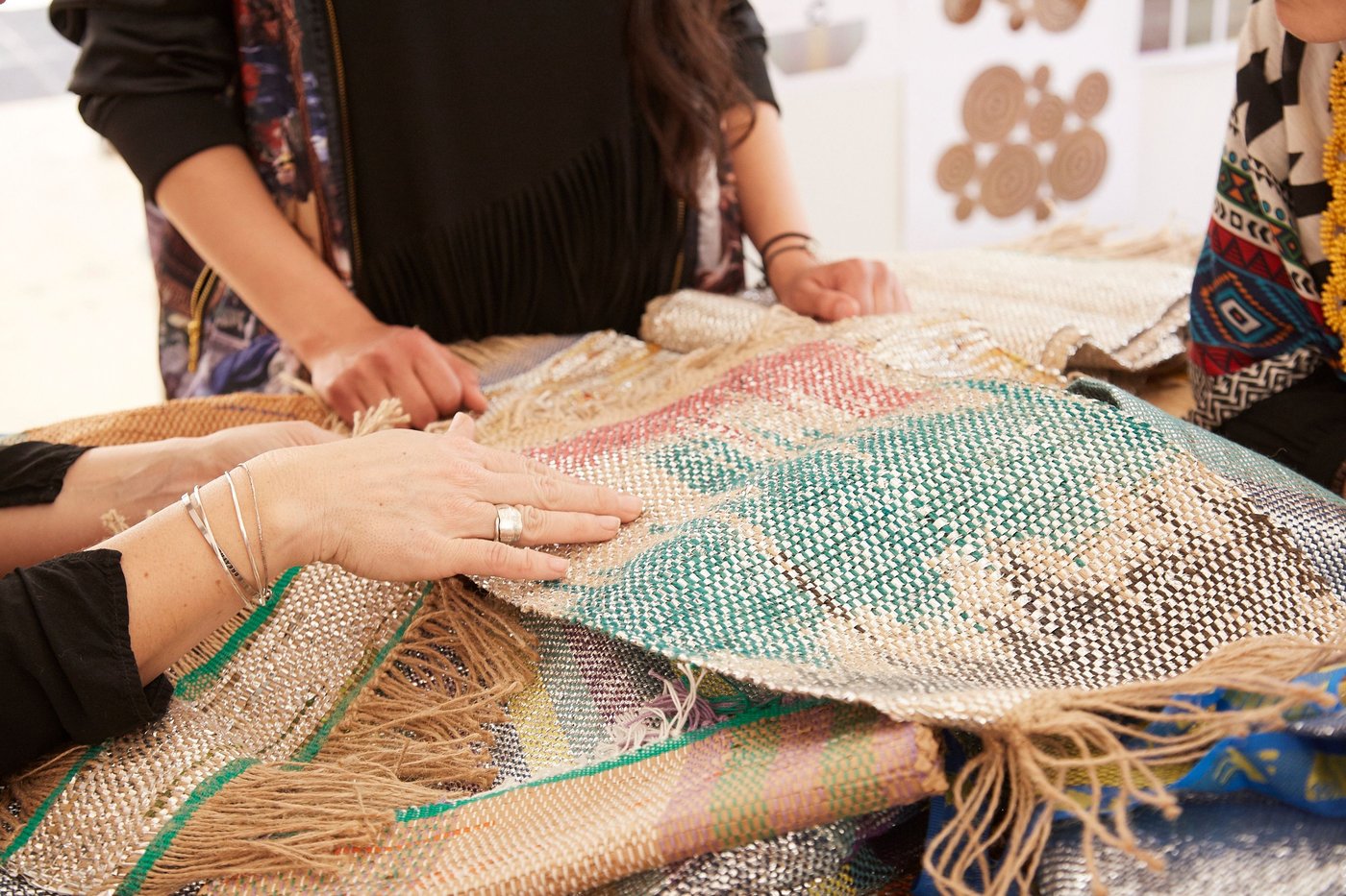 Hands took a piece of woven fabric.