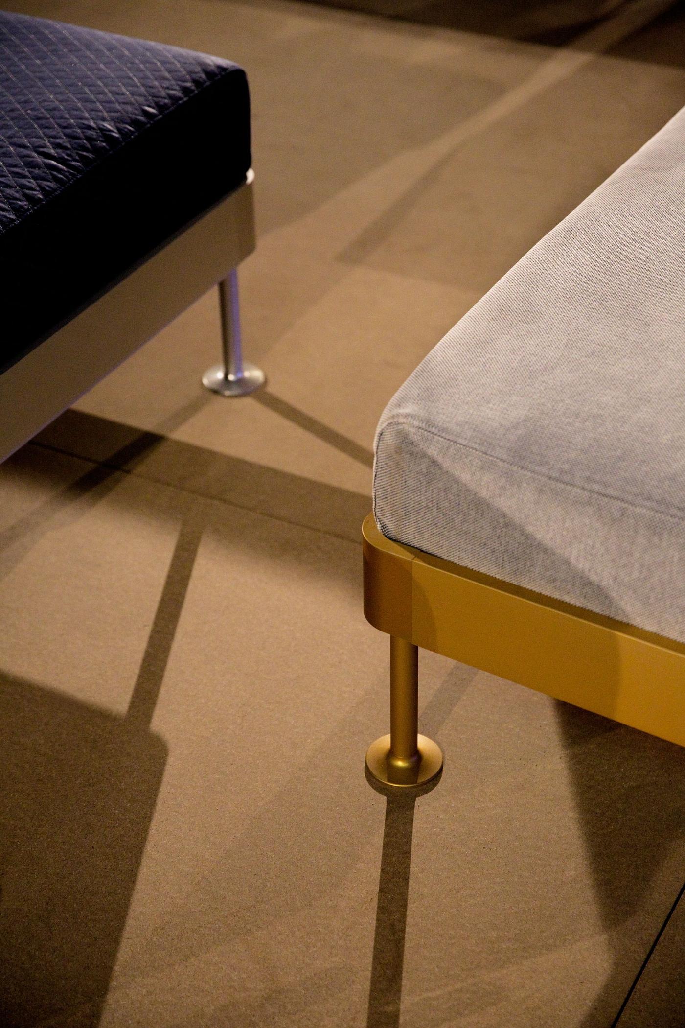 Closeup of the corners and legs of two pieces of furniture.