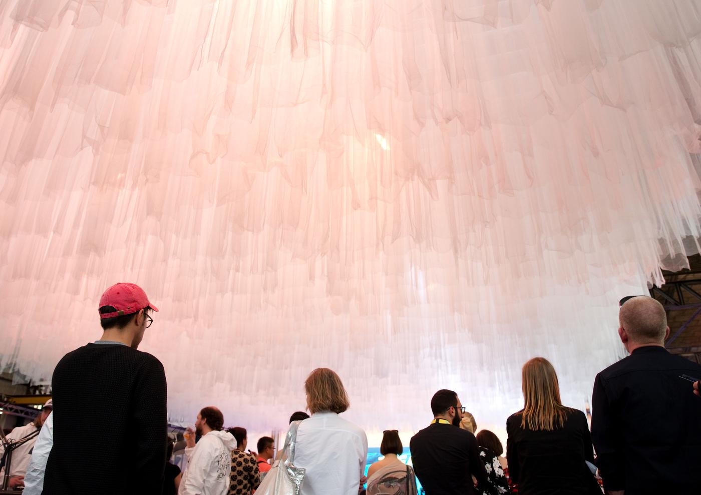 A large group of people in an event setting.